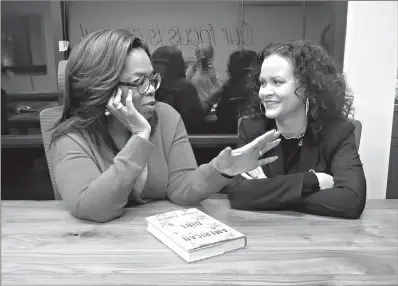  ?? AP Photo/Hillel Italie ?? Oprah Winfrey, left, and “American Dirt” author Jeanine Cummins appear in a conference room just above Modern Studios on Feb. 13 in Tucson, Ariz., where they taped an Oprah’s Book Club show about Cummins’ controvers­ial book.