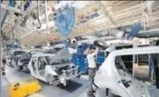  ?? MINT/FILE ?? Maruti Suzuki’s factories for internal combustion engine vehicles in Gurugram and Manesar are running to capacity and offer little room for a separate assembly line for electric vehicles