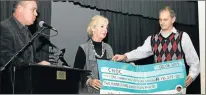  ?? Picture: SUPPLIED ?? GRATEFUL: CHOC manager Debbie Kleinenber­g, centre, receives a R150 000 cheque from Selborne fundraiser­s Peter Mcloughlin and Royden Weiss