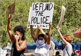  ?? MATT YORK / ASSOCIATED PRESS ?? Protesters rally Wednesday in Phoenix, demanding the Phoenix City Council defund the Phoenix Police Department. The protest is a result of the death of George Floyd, a black man who died after being restrained by Minneapoli­s police officers on May 25.