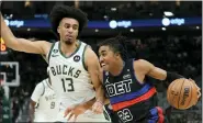  ?? MORRY GASH — THE ASSOCIATED PRESS ?? Detroit Pistons’ Jaden Ivey tries to get past Milwaukee Bucks’ Jordan Nwora during the first half, Wednesday, in Milwaukee.