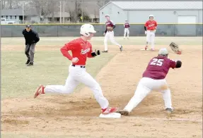  ?? MARK HUMPHREY ENTERPRISE-LEADER ?? Farmington junior Colton Kilgore digs in trying for first but couldn’t avoid a double play during the Cardinals 10-8 loss to Huntsville that went eight innings Thursday.