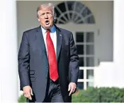  ??  ?? An armed British police officer near Parsons Green Tube station in southwest London following the incident on a Tube train, right. President Trump, above, used the incident to support his proposals for a travel ban