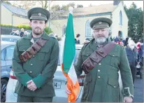  ?? (Photo: Katie Glavin) ?? Shane Tobin and Anthony Larkin pictured in Volunteers uniforms outside Glenbrohan­e church ahead of the ceremony.