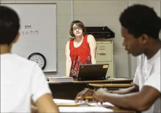  ?? CHAD RHYM / CHAD.RHYM@AJC.COM ?? Jenna Stuart, a geometry teacher at Meadowcree­k High School, instructs a summer-school math course in Norcross. Metro Atlanta school districts are seeking about 1,400 teachers to be fully staffed ahead of the 2017-2018 school year’s start, just about a...