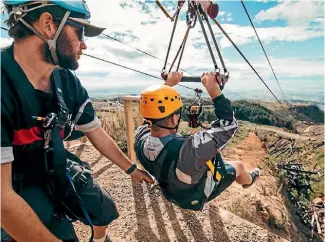  ??  ?? Don’t start that diet yet: bigger people go faster on the zipline.