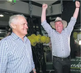  ??  ?? Barnaby Joyce celebrates with Australian Prime Minister Malcolm Turnbull.