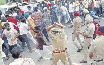  ?? HT PHOTO ?? Police lathi-charging unemployed teachers in Sangrur on Sunday.