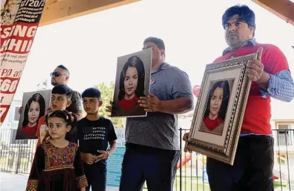  ?? Photos by Jessica Phelps/staff photograph­er ?? Riaz Sardar Khil, right, holds a painting by Lois Gibson of what his missing daughter, Lina, might look like today at age 5.