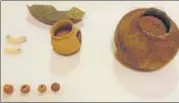  ?? HT ?? ▪ Pottery and beads found during excavation.