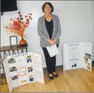  ?? (NWA Democrat-Gazette/Susan Holland) ?? Keli Zimmer, a seventh-grade science teacher at Gravette Middle School, poses Feb. 27 with a couple of the projects prepared by her students for this year’s seventh-grade science fair.