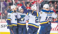  ?? USA TODAY SPORTS ?? The Blues celebrates their overtime winner against the Flames.