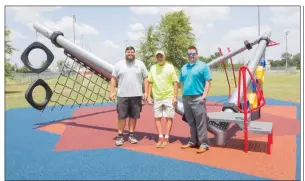  ?? MARK BUFFALO/THREE RIVERS EDITION ?? From left, Searcy Parks and Recreation employees Will Walker and Randy Rudesilla, along with Parks Director Mike Parsons, stand in front of the new HyPar Net play structure near the Searcy Event Center on Higginson Street. Parsons said the apparatus,...