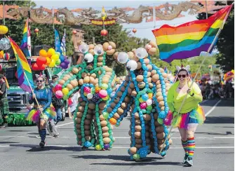  ??  ?? A rainbow of colour was the order of the day on Sunday as participan­ts marched, rolled and vamped their way down Government Street for the annual Victoria Pride Parade.