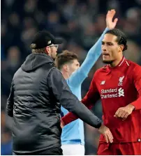  ?? AFP ?? Liverpool manager Jurgen Klopp (left) was hopeful Virgil Van Dijk (right) would be fit to face the Foxes. —