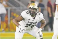  ?? RICK SCUTERI ASSOCIATED PRESS FILE PHOTO ?? Colorado offensive lineman Will Sherman gets set at the line during a September 2019 game against Arizona State in Tempe, Ariz. The scouts were there in big numbers. But NFL prospects who were timed and tested, poked and prodded at the pro days didn’t have the usual contingent of underclass­men looking on and offering their support.