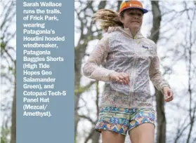  ?? Benjamin B. Braun/Post-Gazette ?? Sarah Wallace runs the trails, of Frick Park, wearing Patagonia’s Houdini hooded windbreake­r, Patagonia Baggies Shorts (High Tide Hopes Geo Salamander Green), and Cotopaxi Tech-5 Panel Hat (Mezcal/ Amethyst).