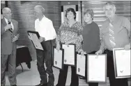  ?? PHOTO BY RICK PECK ?? State Rep. Bill Lant, left, presents proclamati­ons from the Missouri House of Representa­tives and Missouri Senate to the Underwood family for their contributi­ons to the McDonald County School District. From left are Lant, Don Underwood, Dalana Fuller,...