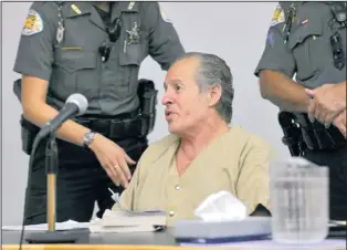  ?? EDDIE MOORE/JOURNAL ?? Santa Fe County Sheriff’s deputies try to calm and quiet accused murderer Arthur Anaya, who frequently spoke out during a hearing Thursday in state District Court opposing his own attorney’s motion for a competency evaluation to be performed by a...