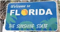  ?? BILL MANNING/GETTY ?? While Florida’s highway centers were once known for offering free orange juice to weary travelers, state workers at the reopened facilities are providing free face masks as part of COVID-19 protocols.