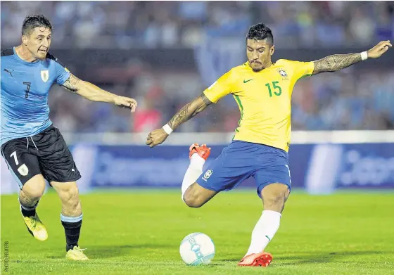  ??  ?? Brazil’s Paulinho scores his first goal against Uruguay in Montevideo.