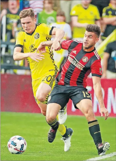  ?? [BARBARA J. PERENIC/DISPATCH] ?? The Crew’s Wil Trapp, left, and Hector Villalba of Atlanta United fight for the ball. Villalba scored two goals.