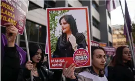  ?? Photograph: Tunahan Turhan/Sopa Images/Rex/Shuttersto­ck ?? A protester holds a picture of Mahsa Amini at a demonstrat­ion marking the Internatio­nal Day for the Eliminatio­n of Violence Against Women in Ankara, Turkey on Sunday 27 November 2022.