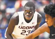  ?? Stephen Dunn / Associated Press ?? UConn’s Akok Akok has stayed on campus during he coronaviru­s pandemic, rehabbing after surgery to repair his Achilles’ tendon.