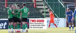  ??  ?? TWO GOOD Rory Donnelly is congratula­te after his second goal