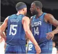  ?? USA TODAY SPORTS ?? Team USA's Devin Booker (15) congratula­tes Draymond Green after the USA beat Spain in an Olympic quarterfin­al in 2021.