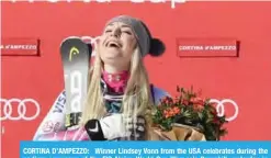  ??  ?? CORTINA D’AMPEZZO: Winner Lindsey Vonn from the USA celebrates during the podium ceremony of the FIS Alpine World Cup Women’s Downhill yesterday in Cortina d’Ampezzo, Italian Alps.—AFP