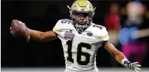  ?? CURTIS COMPTON / CCOMPTON@AJC.COM ?? Quarterbac­k TaQuon Marshall guided the Yellow Jackets to 605 total yards against Tennessee.