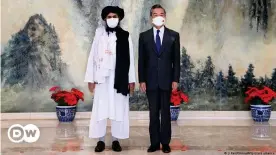  ??  ?? Taliban co-founder Abdul Ghani Baradar meets China's foreign minister Wang Yi