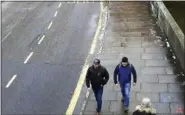  ?? METROPOLIT­AN POLICE VIA AP, FILE ?? Men identified as Ruslan Boshirov and Alexander Petrov walking on Fisherton Road, Salisbury, England