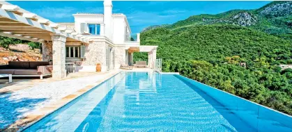  ?? ?? CUTTING EDGE: The jaw-dropping infinity pool at Barbati View. Below: The amazing view at Villa Althea