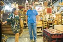  ?? ?? Natalie Wetheringt­on, 49, of Tampa, shops with the help of owner Paul Donofrio as she looks for pieces to furnish her newest property in Ybor City.