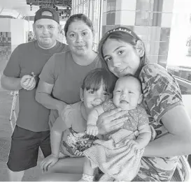  ?? Molly Hennessy-Fiske / Los Angeles Times ?? Hiram Ramirez, 28, was denied a birth certificat­e for her newborn daughter, Dulce, in McAllen. She is seen with her husband, Eduardo Mendo, 41, and daughters Alejandra, 3, and Esli, 14.