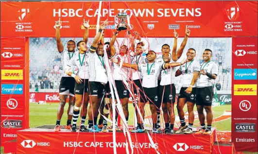  ??  ?? Fiji players celebrate after winning the HSBC World Rugby Sevens tournament at the end of the final match between United States and Fiji on Dec 9 at the Cape Town Stadiumin Cape Town. (AFP)