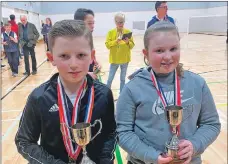  ??  ?? Daniel Graham, left, won the P7 singles, and went on to win the mixed doubles with Emily McMurchy, right.
