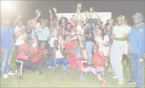  ??  ?? The Guyana Police Force Athletic Club posing with their hardware following the Boyce/Jefford Classic last night at the MacKenzie Sports Club (MSC) ground. The winners are flanked by Edison Jefford and Colin Boyce. (Orlando Charles photo)