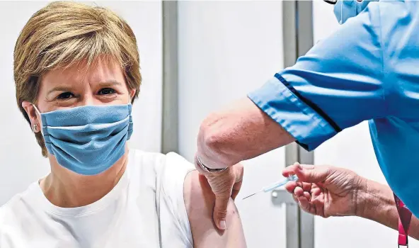  ??  ?? PANDEMIC: First Minister Nicola Sturgeon announced the cash as she revealed a ‘milestone’ has been reached in the vaccinatio­n roll-out.