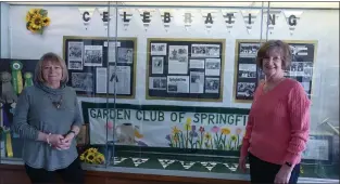  ?? SUBMITTED PHOTO ?? Maryann DeSanto, left, and Janet Lewis stand by the Garden Club of Springfiel­d’s 90th Anniversar­y exhibit at Springfiel­d Township Library.