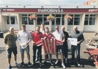  ??  ?? The Bristol City fans who will cover 326 miles as they take on the “Stadium2St­adium” challenge.