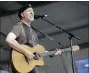  ?? DAVE MARTIN - THE AP ?? Richard Thompson performs during the 2008 New Orleans Jazz & Heritage Festival at the New Orleans Fairground­s Racetrack in New Orleans, on May 2, 2008. Thompson’s book “Beeswing: Losing My Way and Finding My Voice 1967–1975” released on April 6.