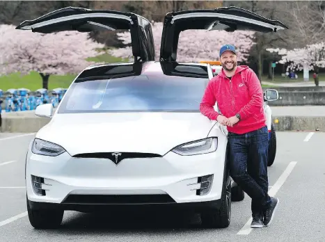  ?? NICK PROCAYLO ?? Zach Taylor says his Tesla X is a “dream” and “so great to drive.” He spends about $150 a month in electricit­y to operate the e-car.