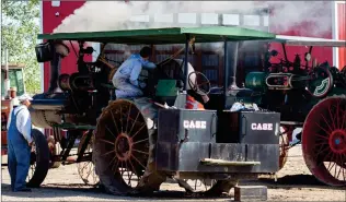  ?? HERALD FILE PHOTO ?? Operators fire up a classic steam tractor during a past event at Coyote Flats Pioneer Village.