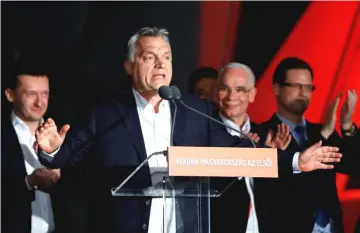  ??  ?? Orban addresses supporters after the announceme­nt of the partial results of parliament­ary election in Budapest, Hungary. — Reuters photo