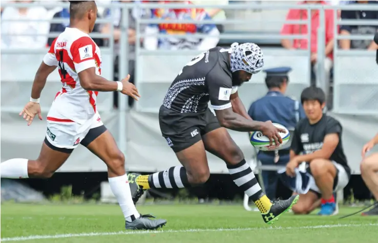 ?? Photo: Kenji Demura ?? Fiji Airways Flying Fijian second five eight Levani Botia scores the first try against Japan at the Kamaishi Recovery Memorial Stadium in the Iwate Prefecture on July 27, 2019. Japan won 34-21 in their Pacific Nations Cup opener.