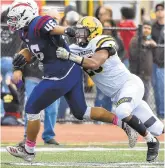  ?? APRIL GAMIZ/THE MORNING CALL ?? Liberty’s Kendrick Wesley fights for additional yardage as Freedom’s Jalen Stewart tries to stop his progress Saturday at Bethlehem Area School District Stadium.