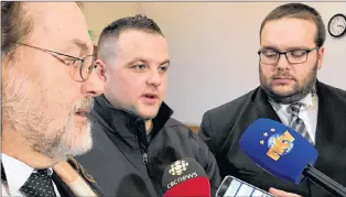  ?? TARA BRADBURY FILE PHOTO/THE TELEGRAM ?? Steven Neville and his defence lawyers, Bob Buckingham (left) and Robert Hoskins (right), speak to the media following the jury’s not guilty verdict in December at Newfoundla­nd and Labrador Supreme Court in St. John’s.